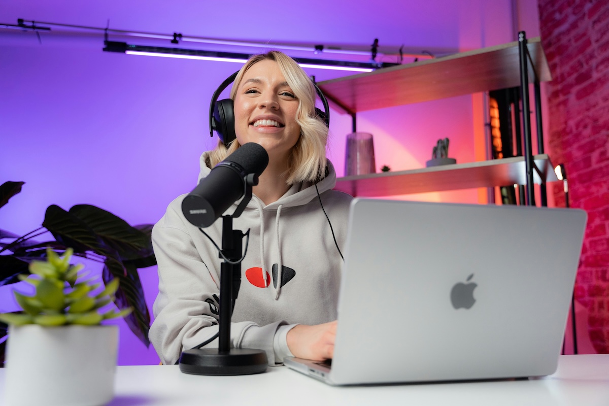 Podcast host recording at a desk being analyzed for AI reframe