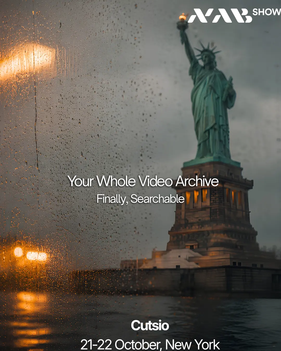 The Statue of Liberty through a rain-covered window