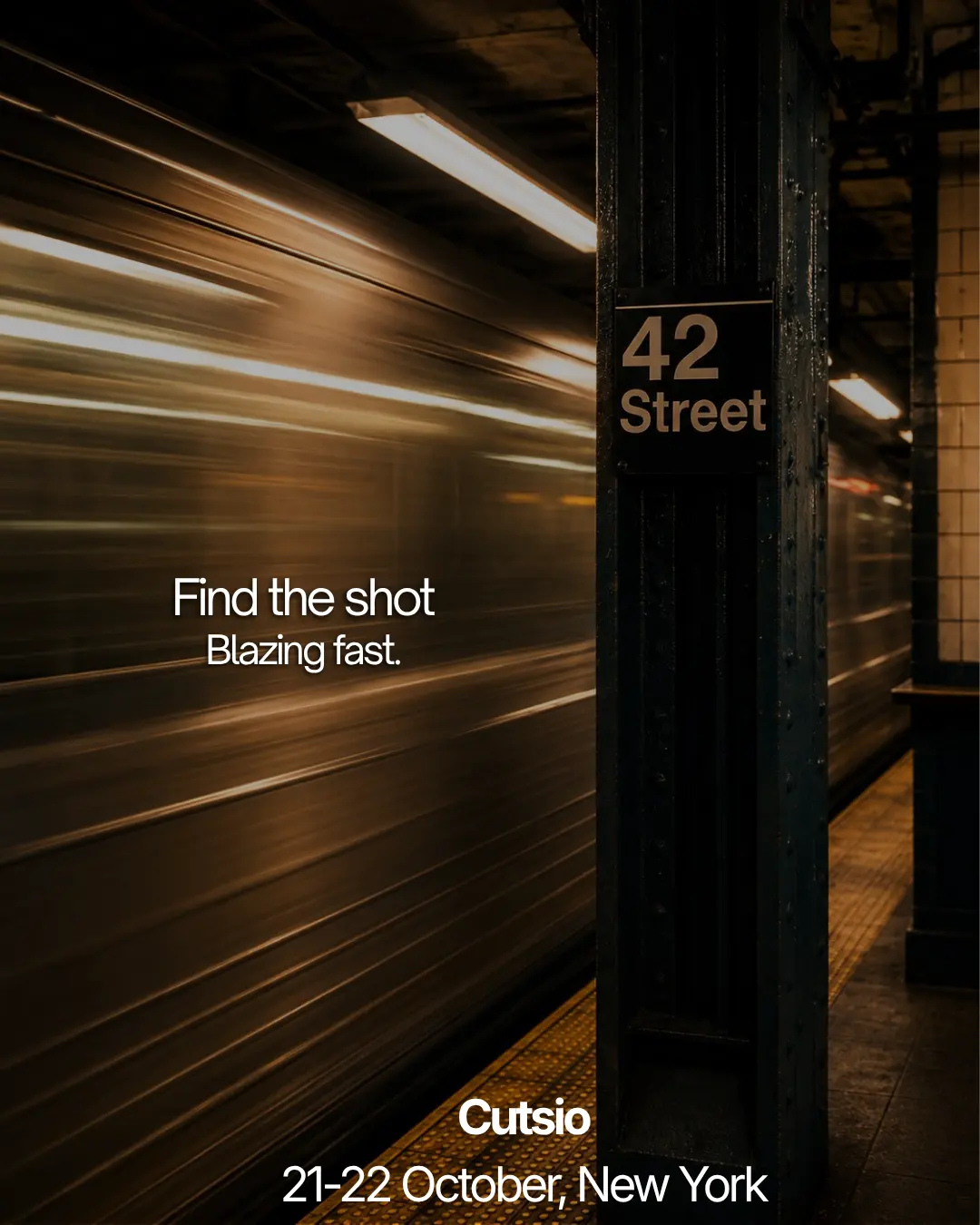 A subway train rushing through 42nd Street station